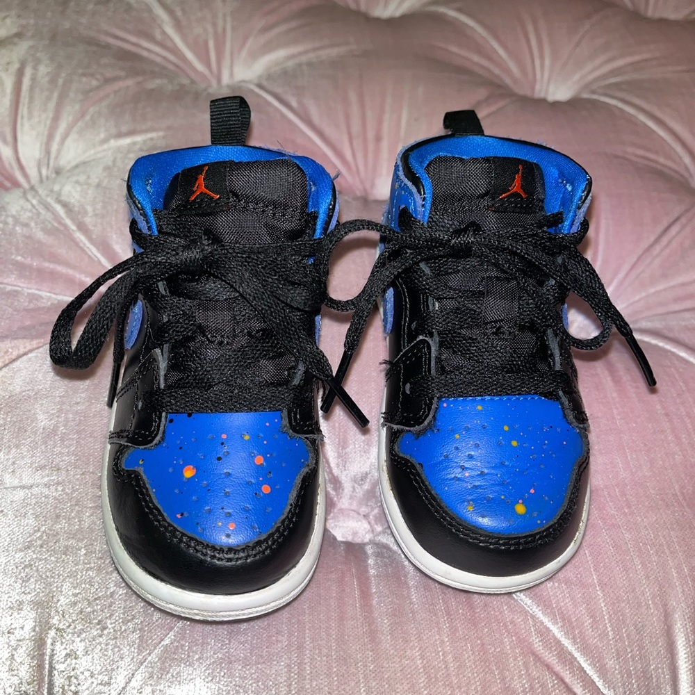 Jordan 1’s. High top blue & black w/ orange paint splatter. Size 6c